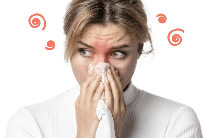 Kobieta wydmuchuje nos, cierpi na zapalenie zatok